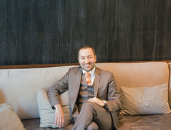 Fernando Gonzalez Revised Editorial Fernando Gonzalez sitting on a couch