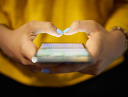 Social media / texting Woman using her smartphone