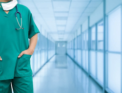 Practice Management doctor physician nurse scrubs hospital (Getty/NanoStockk) A physician in scrubs in a hospital hallway