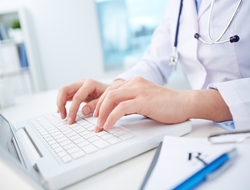 Doctor and laptop (credit: Getty/shironosov) Doctor typing on laptop