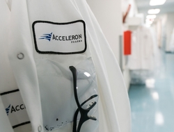 Acceleron Acceleron badge on lab coat