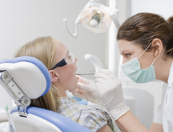 Dentist with child (credit: Getty/Robert Daly) Dentist with child