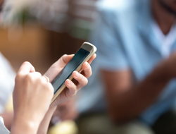 woman holding smartphone woman holding smartphone