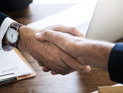 Handshake business deal executives Handshake business deal executives