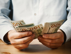 compensation salary money man counting money
