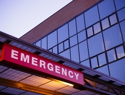 Healthcare Hospital Emergency Room Sign CREDIT: Getty/MJFelt A lighted emergency room sign outside of a hospital