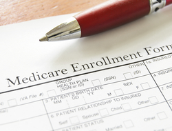 Medicare enrollment form (Credit: Getty/zimmytws) Medicare enrollment form and pen