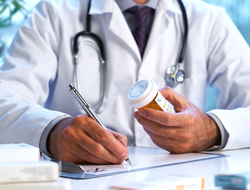 Doctor writing prescription pharmacist drugs opioids RX CREDIT: Getty/18percentgrey A coctor writing a prescription