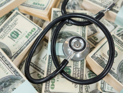 Bundled payments in healthcare Stethoscope on top of bundles of money