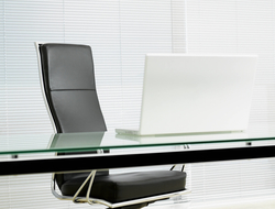 C-suite desk chair Empty desk chair in modern office