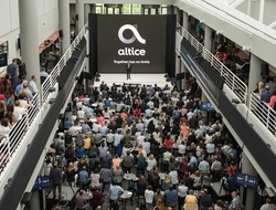 Altice USA Altice USA logo amid crowd