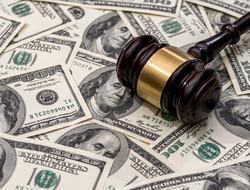 Gavel on top of money Gavel on top of cash