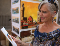 Go Local Artwork Tour Image of woman holding artwork