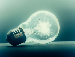 Light bulb on dark background on its side Light bulb on dark background