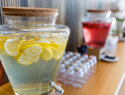 Melia Plastics Editorial Glass drink dispenser and glasses on a table