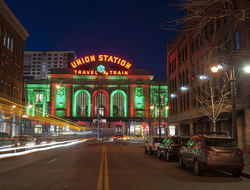 Denver Union Station Holidays Getty View of Union Station in downtown Denver, Colorado, taken at night from the middle of a street. The train station is lit up for the Christmas Holiday season