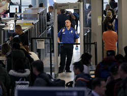 Government Shutdown TSA Newscred Editorial Travel Group Only Transportation Security Administration agents help passengers through a security checkpoint at Newark Liberty International Airport