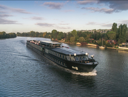 The B - U by Uniworld U by Uniworld's ship The B as it sails along the Seine