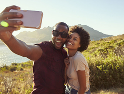 Beach Selfie Getty Young Couple Pose For Holiday Selfie On Clifftop