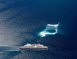 SeaDream Innovation Image of he new yacht sailing next to a glacier